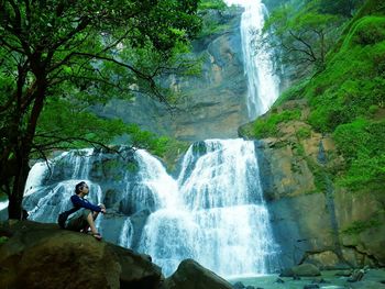 Scenic view of waterfall in forest