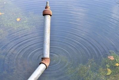 High angle view of water pipe on lake