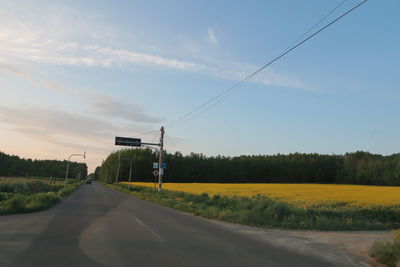 Road by land against sky