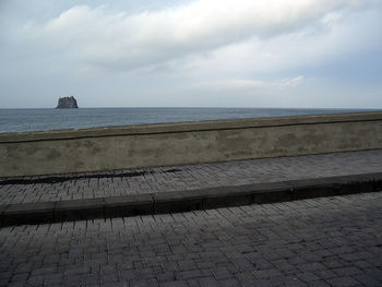 Scenic view of sea against cloudy sky