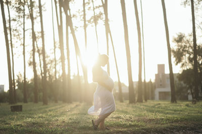 Rear view of boy playing in park