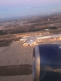 Aerial view of airport runway against sky