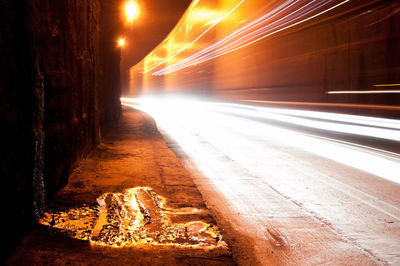 Light trails on railroad track at night