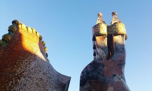 Low angle view of statue against sky