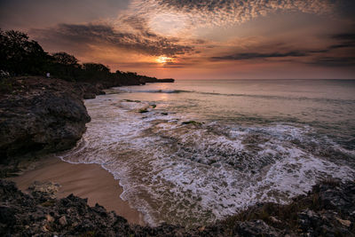 Scenic view of sea against sky during sunset