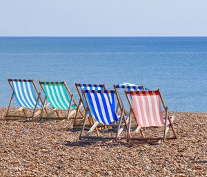 Scenic view of beach against blue sky