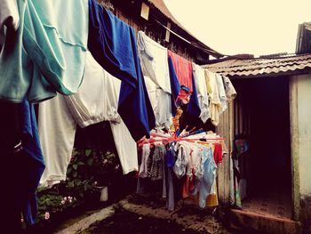 Clothes drying against buildings at market