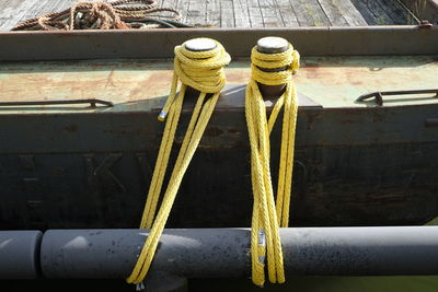 High angle view of rope tied on wood