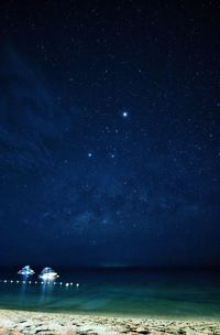 Scenic view of star field against blue sky