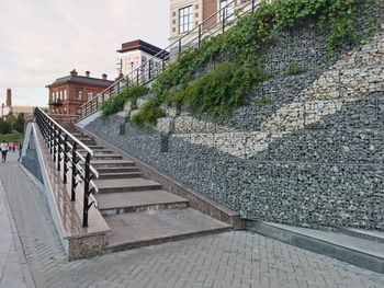 Staircase by building in city