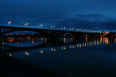 Illuminated bridge at night