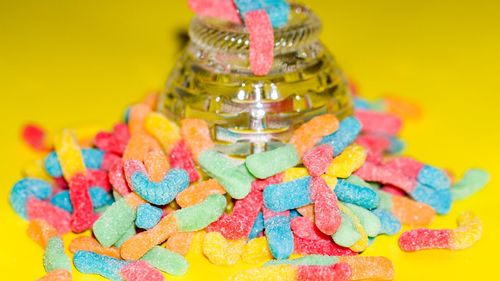 Close-up of multi colored candies on table
