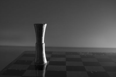 Close-up of chess board against sky