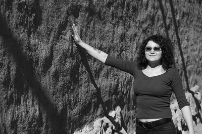 Portrait of woman standing by tree trunk in turkey