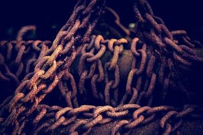 Close-up of rope tied on rusty metal
