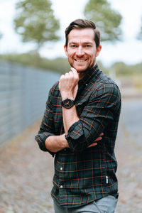 Portrait of young man standing outdoors