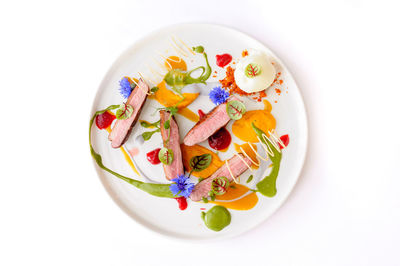 High angle view of food in plate on white background