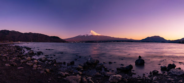 Scenic view of lake against sky during sunset