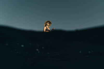 A young woman enjoys a standup paddle board on lost lake in oregon.