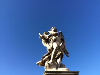 Low angle view of angel statue at ponte sant angelo