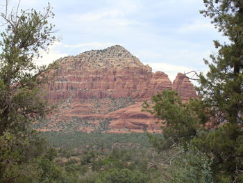 Rock formations on landscape against sky