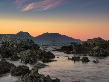 Scenic view of sea against sky during sunset