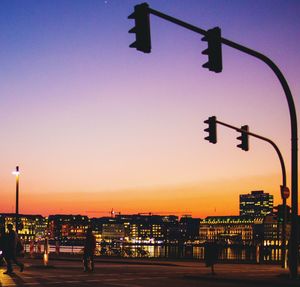 Street light against sky at sunset