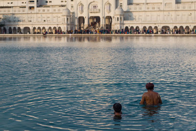 View of two people swimming in pool