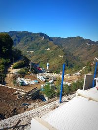 Scenic view of mountains against clear blue sky