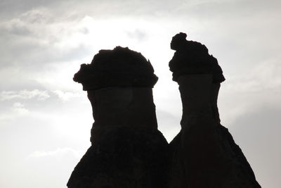 Low angle view of silhouette man against sky