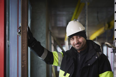 Portrait of smiling male engineer at construction site