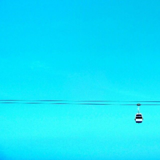 cable, copy space, power line, power supply, low angle view, no people, blue, electricity, day, outdoors, clear sky, nature, parallel, hanging, technology, sky, telephone line, water, beauty in nature