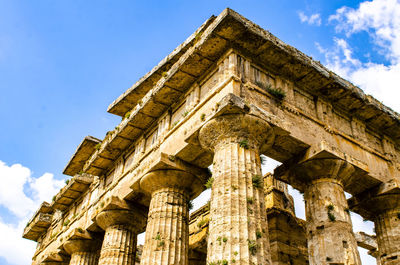 Detail view of historical building against clear blue sky  , temple of paestum. italy