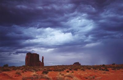 Rock formations on landscape against sky