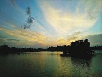 Scenic view of lake against sky during sunset