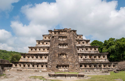 Low angle view of historical building against cloudy sky