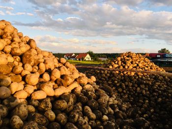 Stack of rocks on land against sky