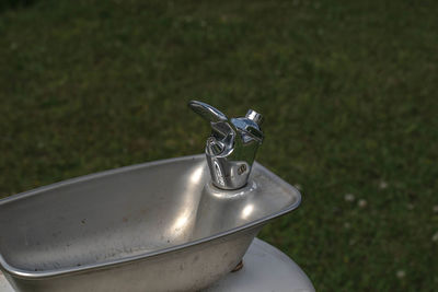 High angle view of faucet on field