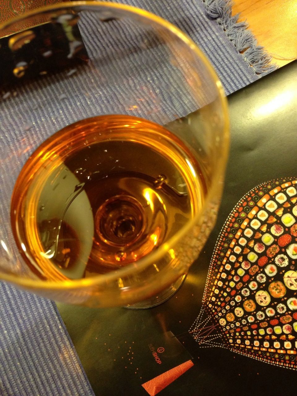 indoors, still life, high angle view, close-up, pattern, table, design, no people, yellow, art and craft, directly above, shiny, food and drink, drink, glass - material, refreshment, metal, freshness, creativity, orange color