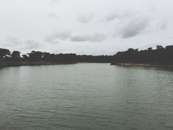 Scenic view of sea against cloudy sky