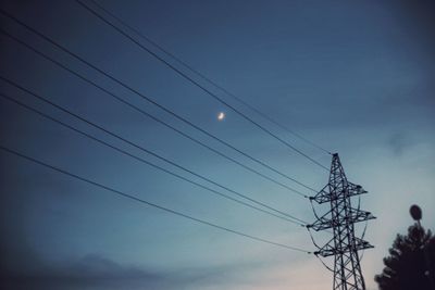 Low angle view of electricity pylon
