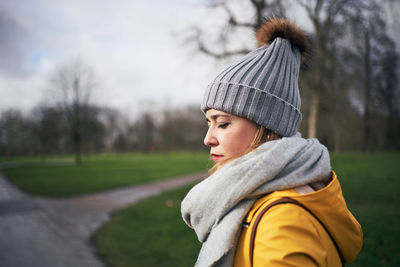 Portrait of mid adult woman looking away in winter