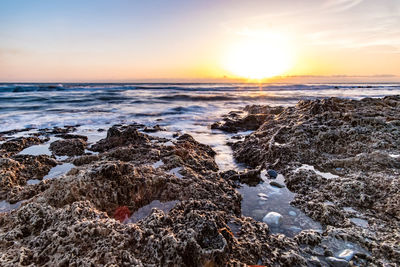 Scenic view of sea against sky during sunset