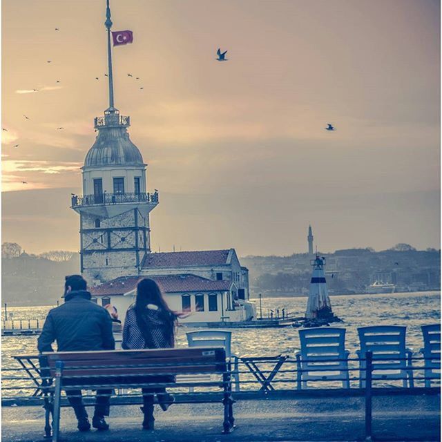 architecture, building exterior, built structure, sky, sunset, travel, travel destinations, religion, sea, tourism, place of worship, famous place, dome, men, bird, cloud - sky, outdoors, incidental people, animal themes