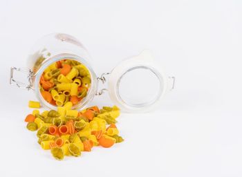 Close-up of drink in jar against white background