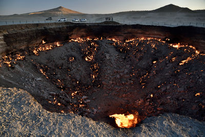 High angle view of burnt landscape against sky