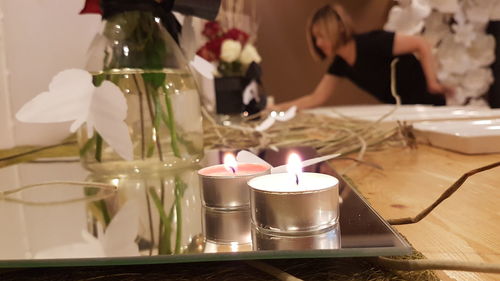 Close-up of candles in plate