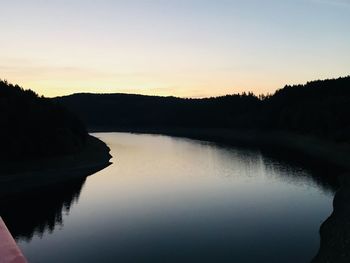 Scenic view of lake against sky during sunset