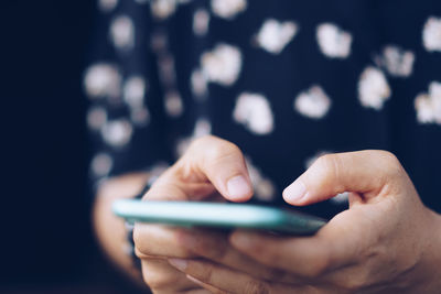 Close-up of person using mobile phone