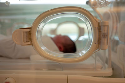 Baby in incubator at hospital
